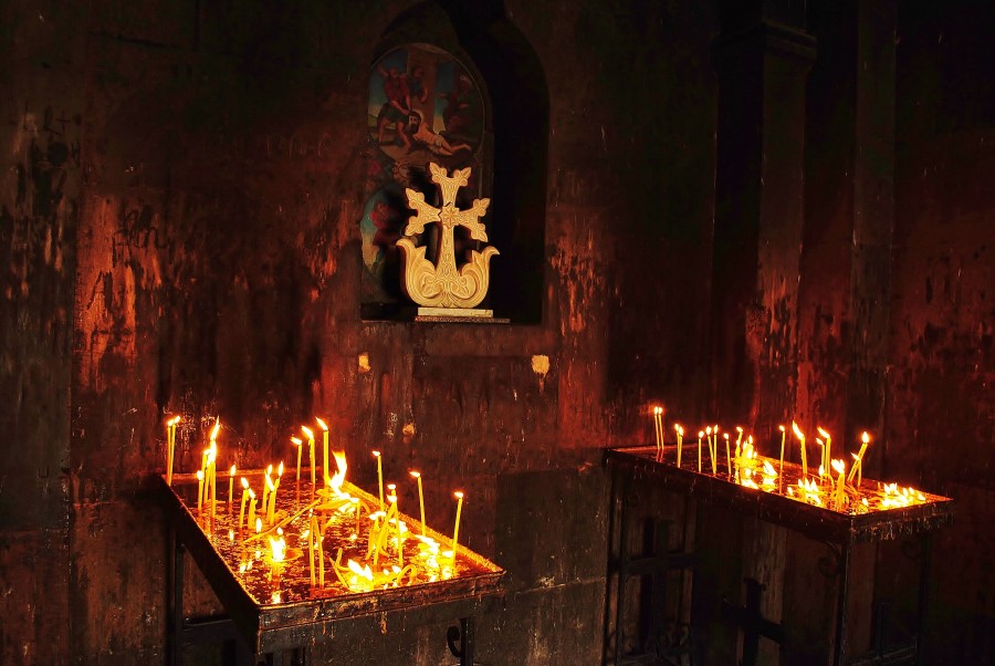 Cross and candles in the Khor Virap church. Armenia.
