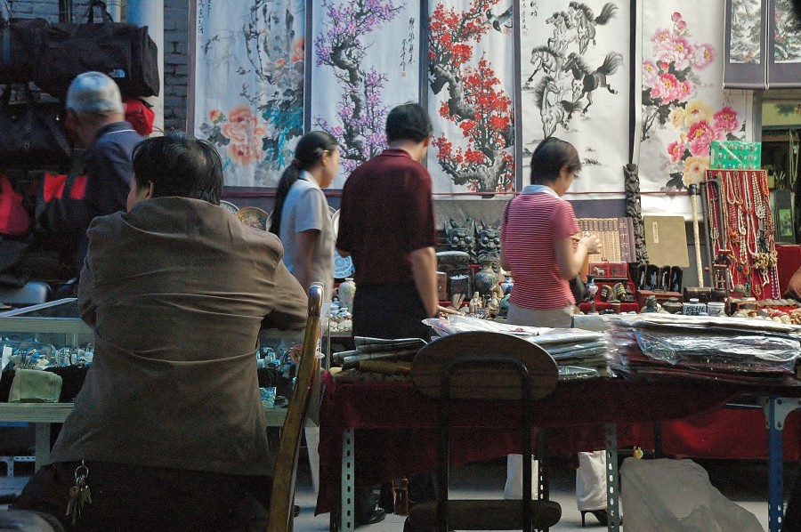 At the bazaar in Xi'An. Chinese art in the background.