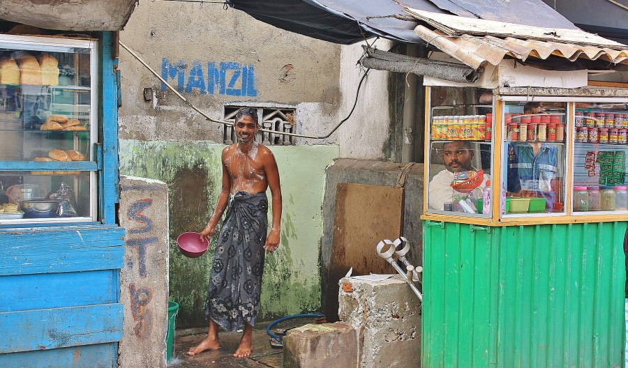 Street shower. Colombo. Sri Lanka.