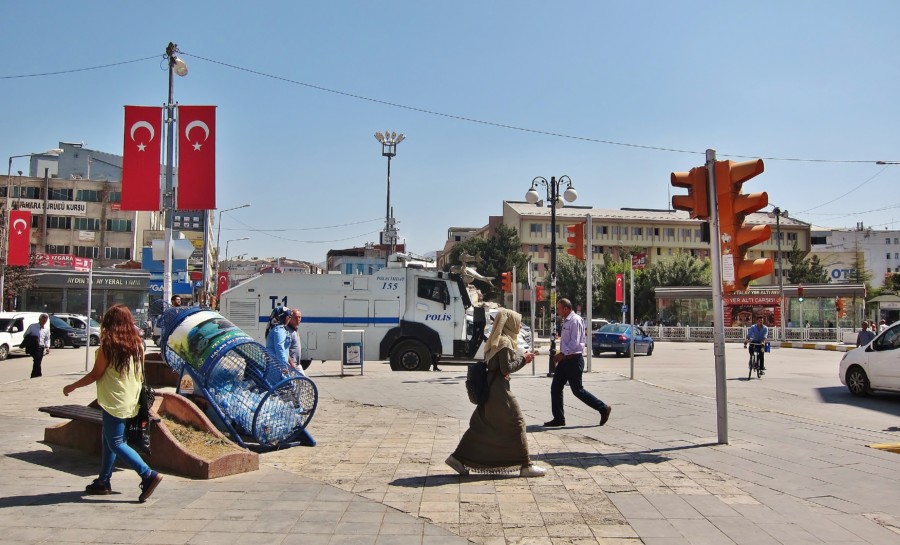 A street scene from the city of Van and an armored car in the distance. Turkey less visited.
